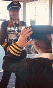 A future female pilot sees her reflection at a Cleveland Girls in Aviation event.