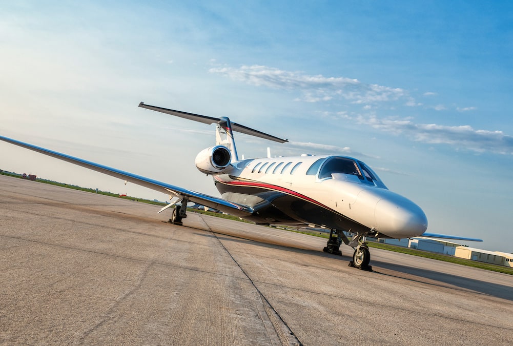 exterior of light private jet on runway