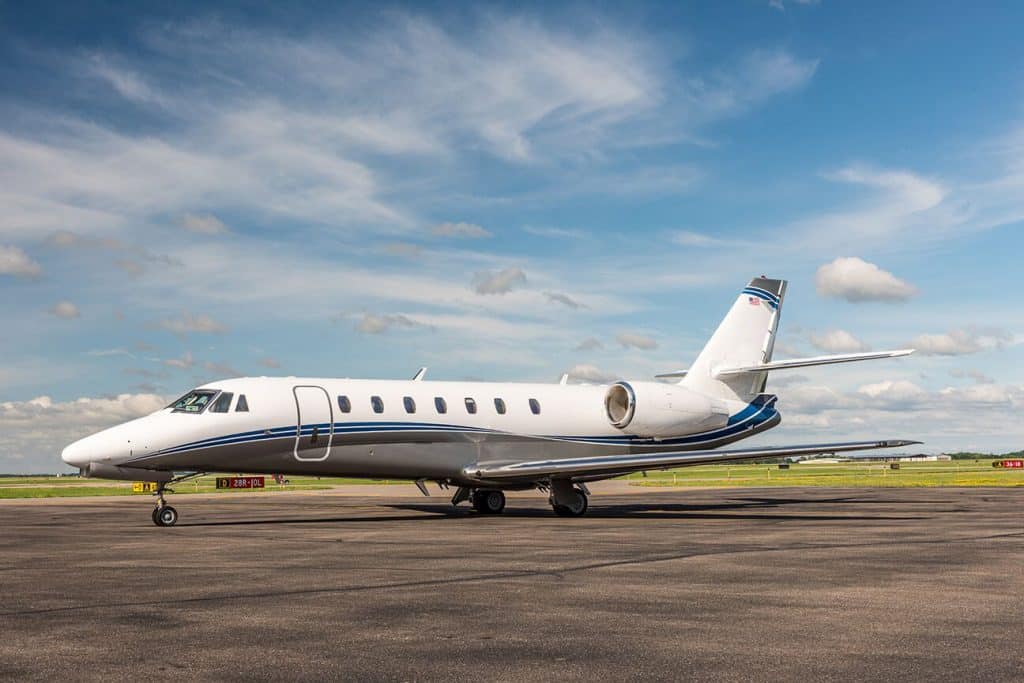 super midsize private jet exterior shot on runway