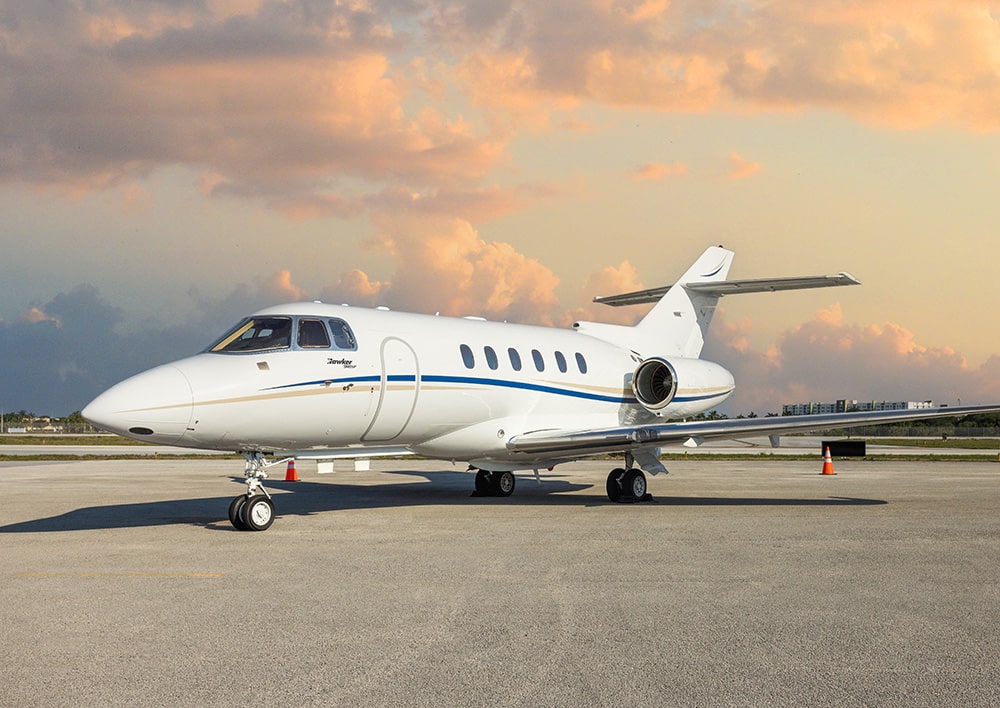exterior of midsize private jet on runway