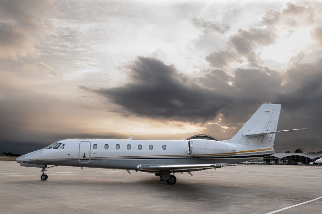 super midsize private jet exterior shot on runway 