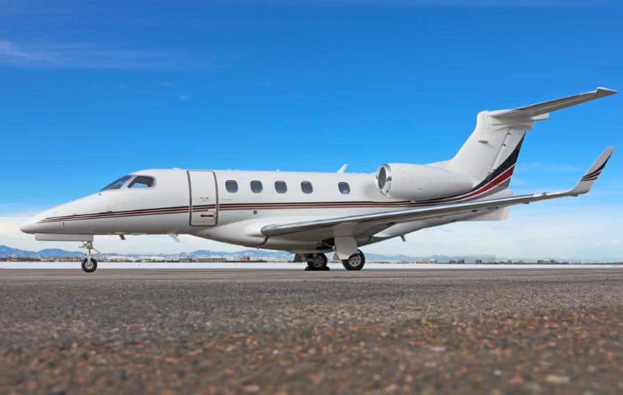 light private jet exterior shot on runway 