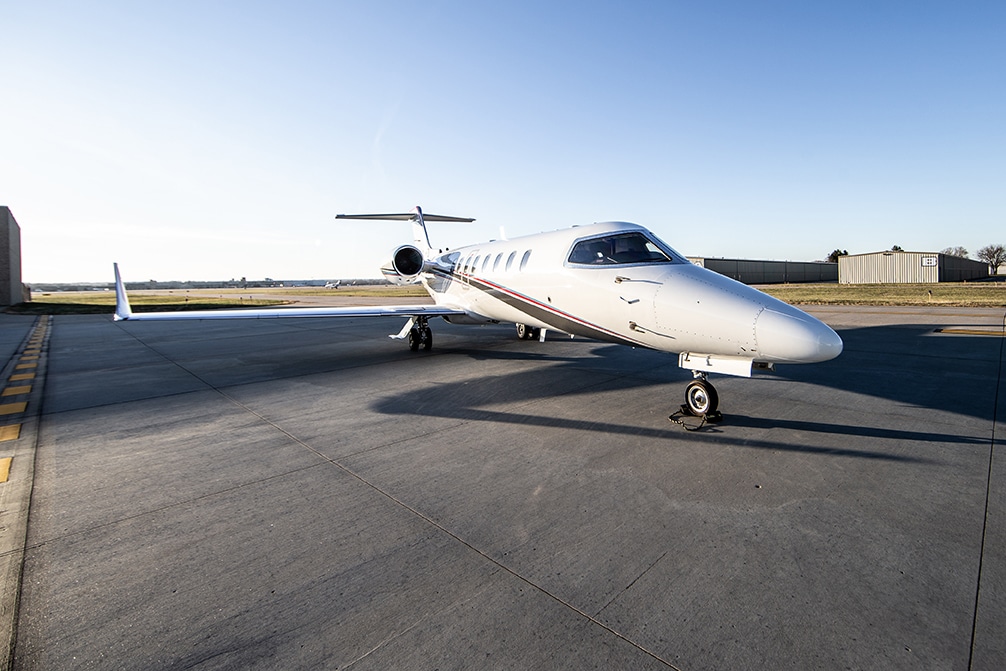midsize private jet on runway