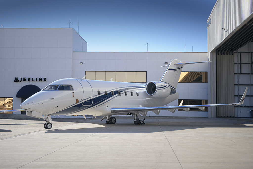 Exterior of Challenger 604 Heavy private jet in front of private terminal